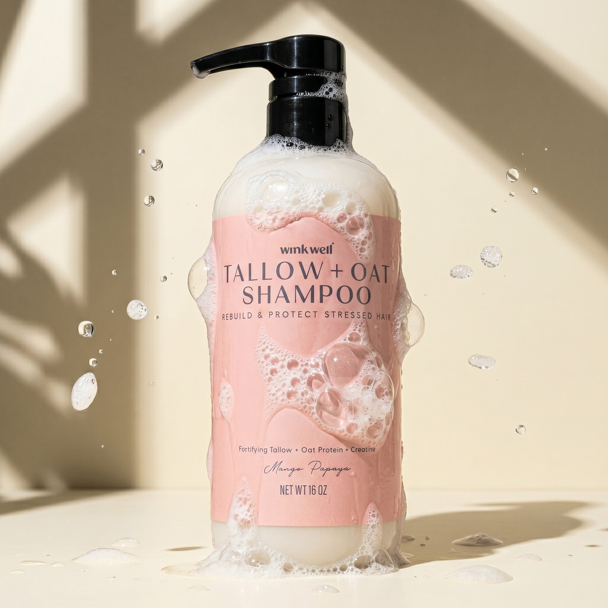 Bottle of Wink Well Tallow + Oat Shampoo on a beige background