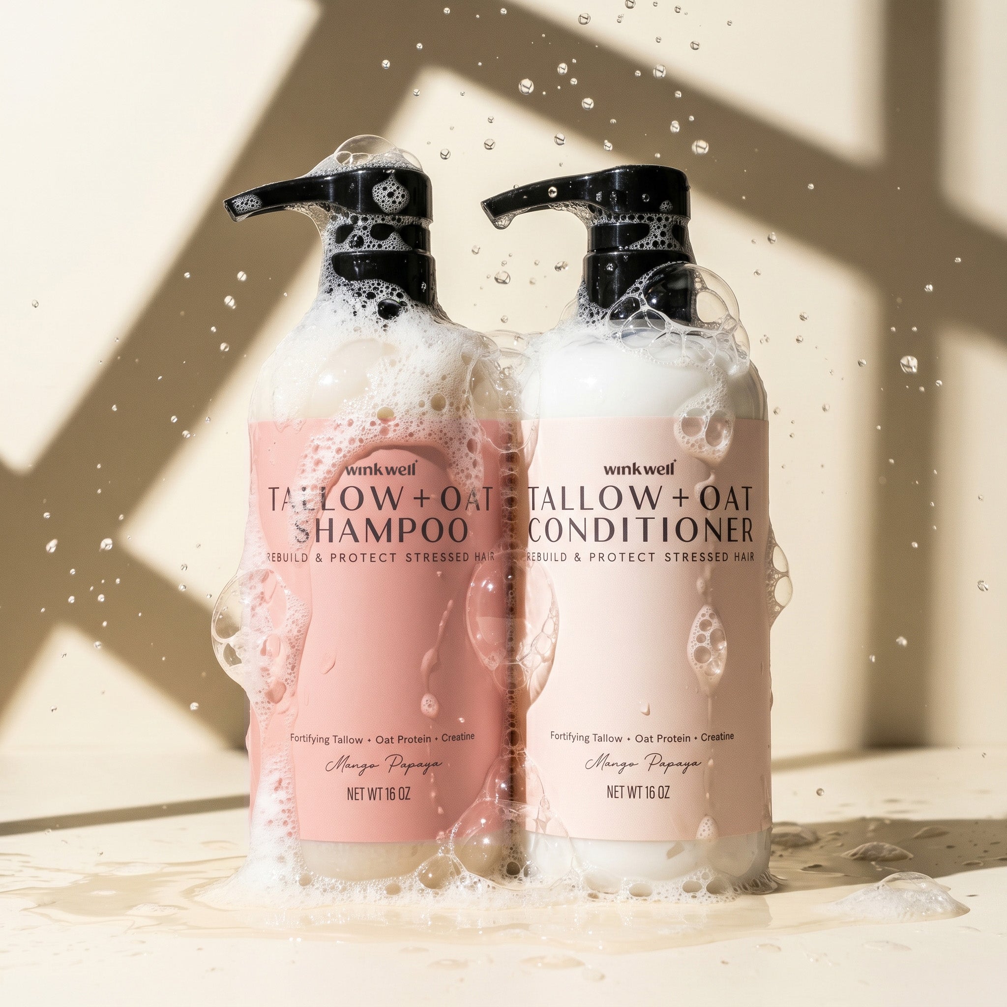 Two bottles of Wink Well Tallow + Oat Shampoo and Conditioner on a light background