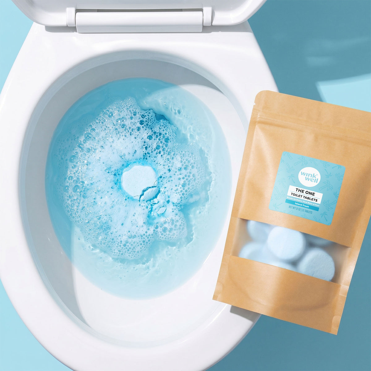 Toilet with blue Wink Well Toilet Tablet dissolving and a package of Wink Well Toilet Tablets on a light blue background
