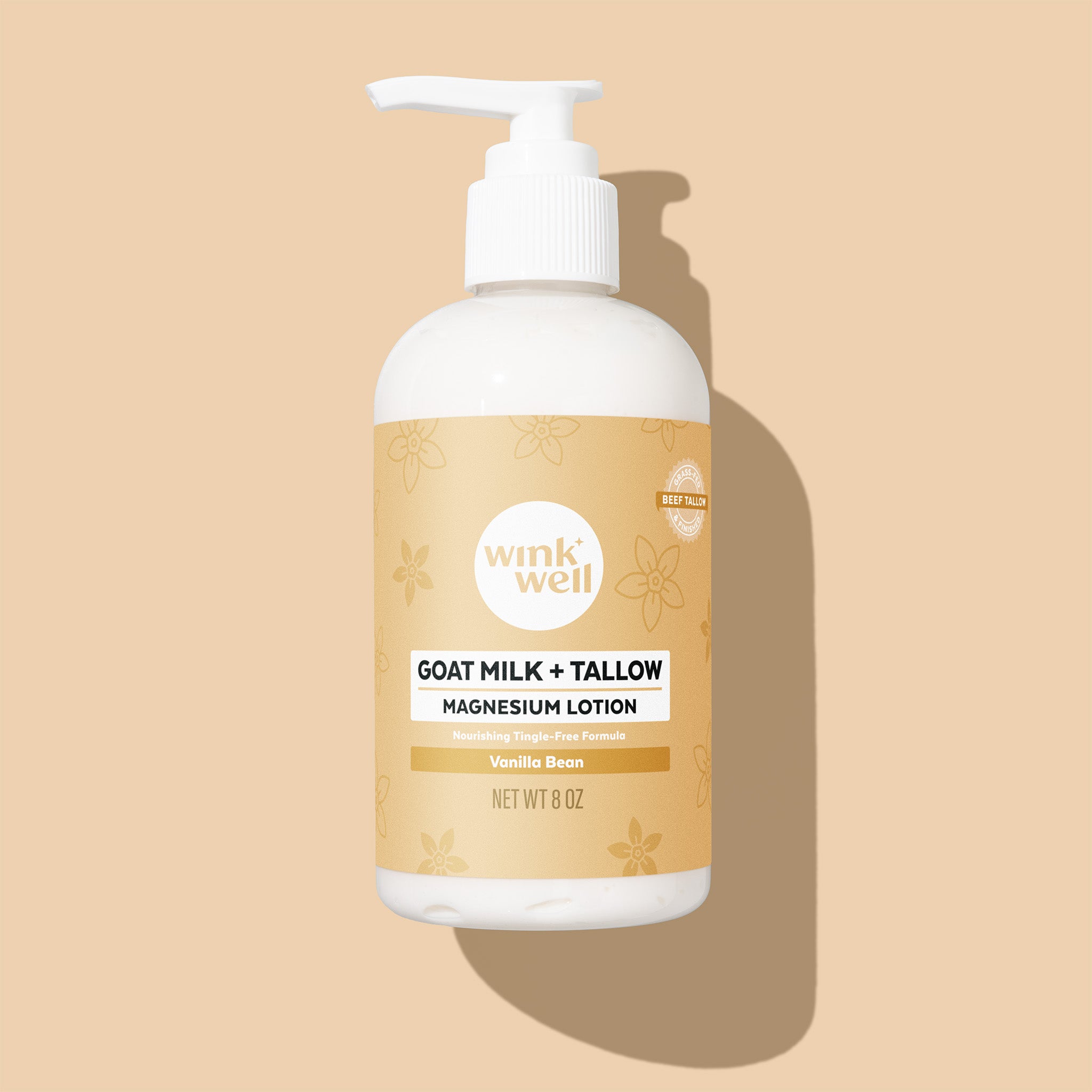 Vanilla Bean Wink Well Goat Milk & Tallow Magnesium Lotion bottle with pump on a beige background