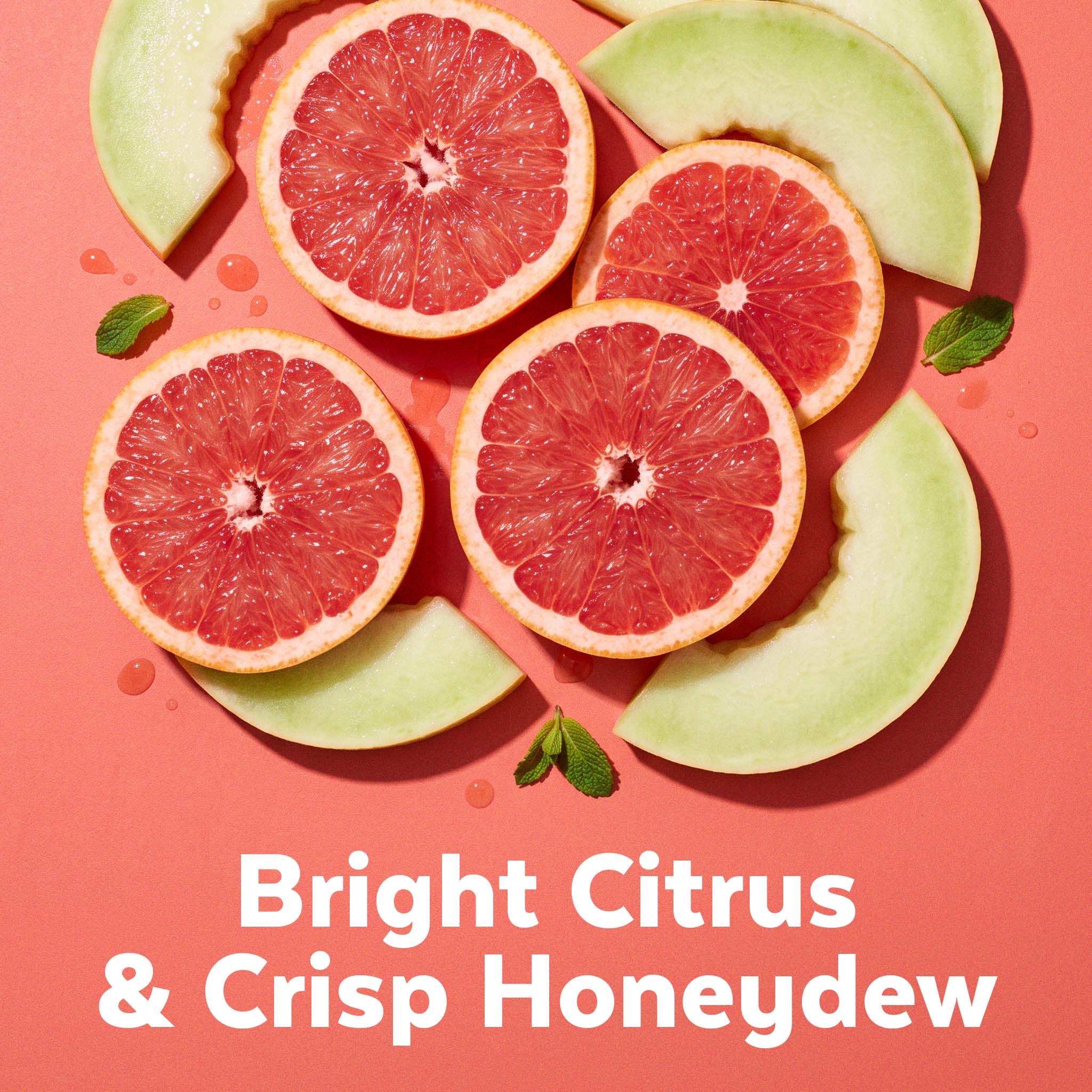 Grapefruit and honeydew melon slices with mint on coral, labeled Bright Citrus & Crisp Honeydew