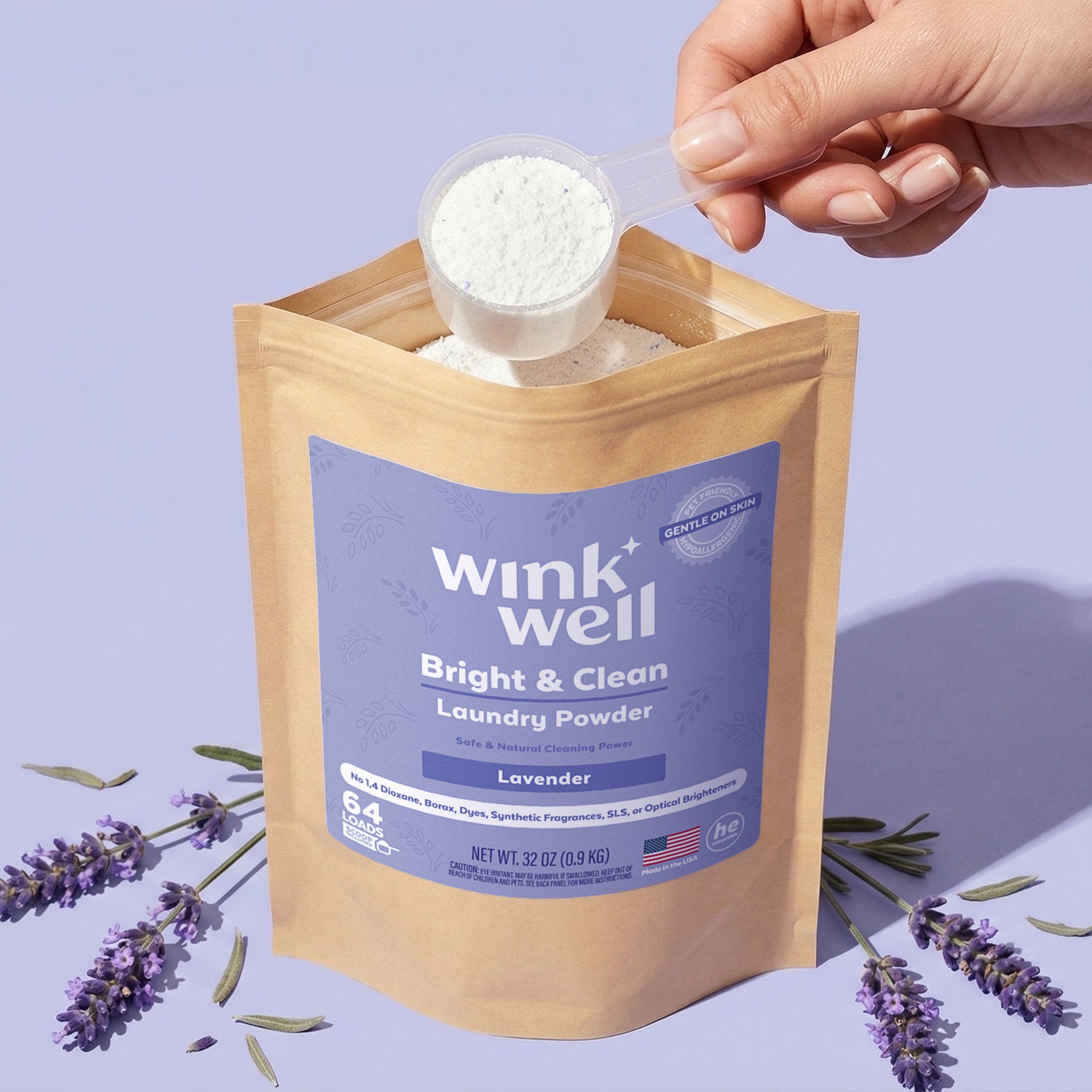 Wink Well laundry powder package with lavender flowers on a light purple background